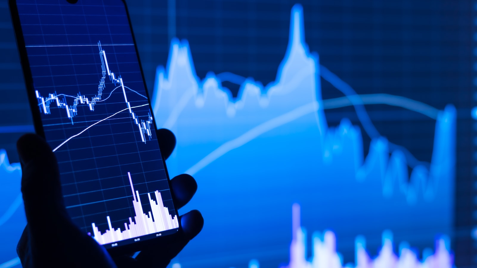 A person checking a stock chart on a smartphone — a realistic strategy guide to earning 10-15% annual returns from a European base in 2026.