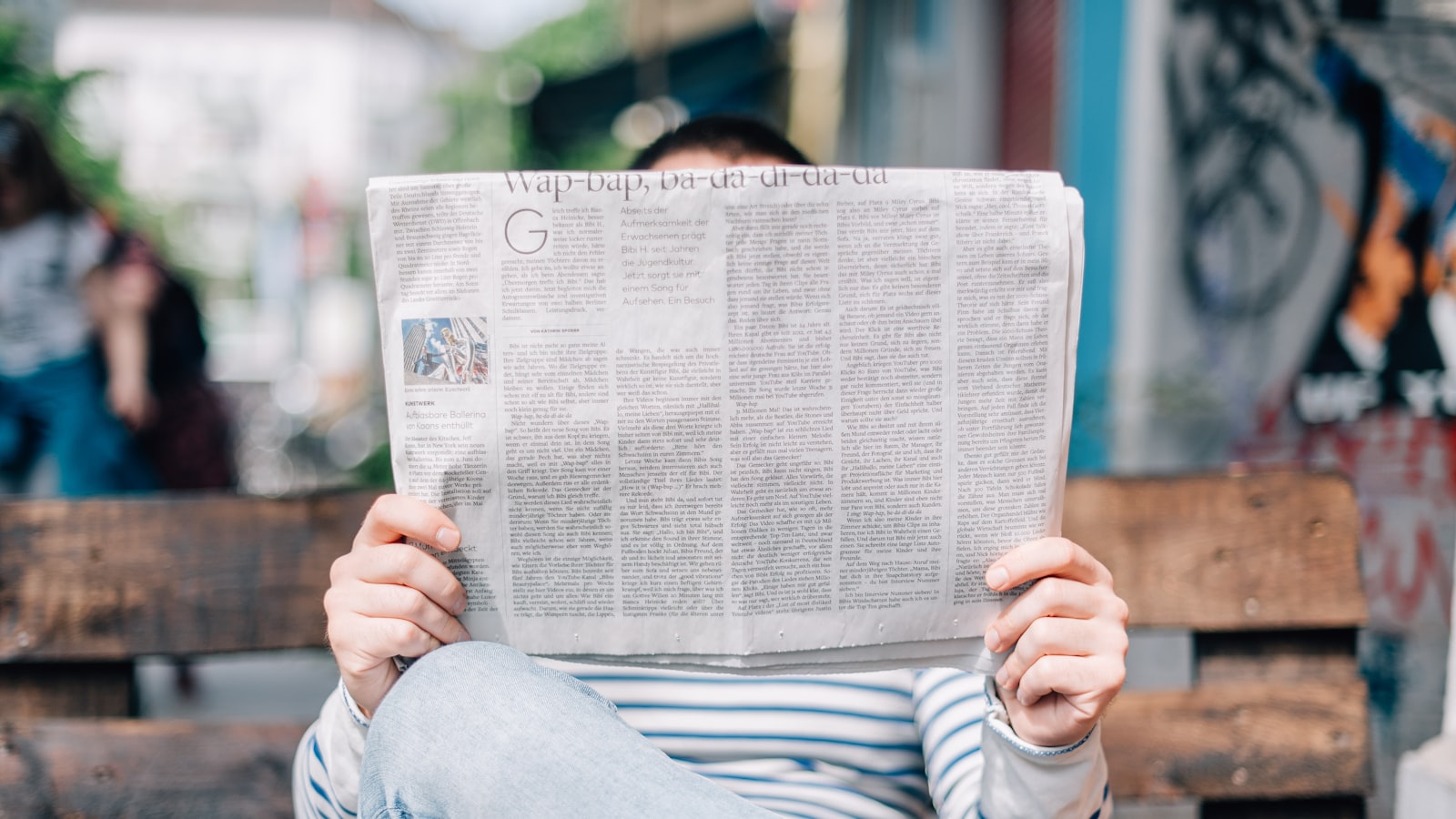 A pile of newspapers with warning headlines — red flags that identify a risky platform.