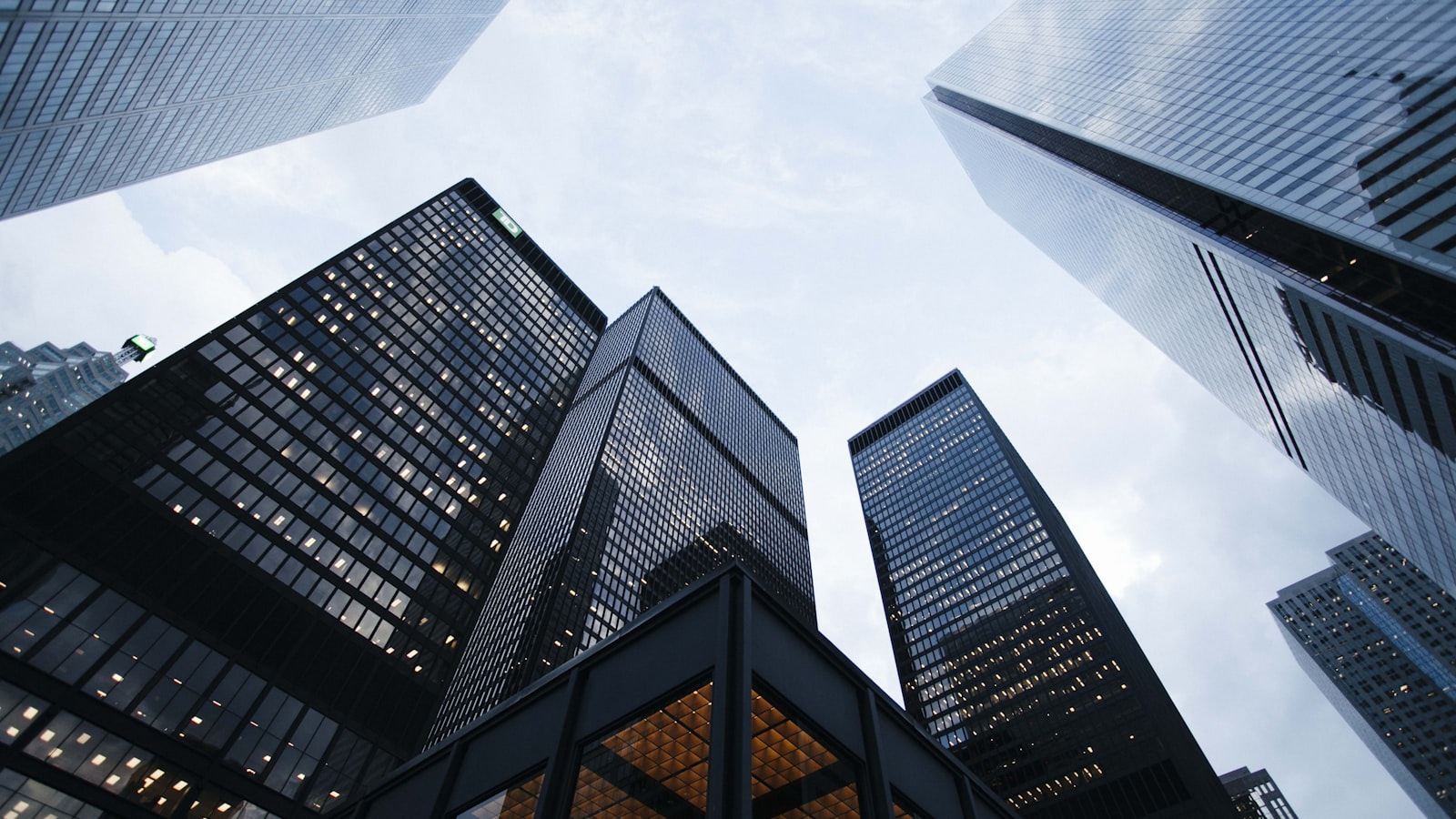 Modern apartment buildings — the choice between Mintos consumer loans and EstateGuru real estate.